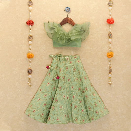 Girls Green Ruffled Blouse And Floral Lehenga Set