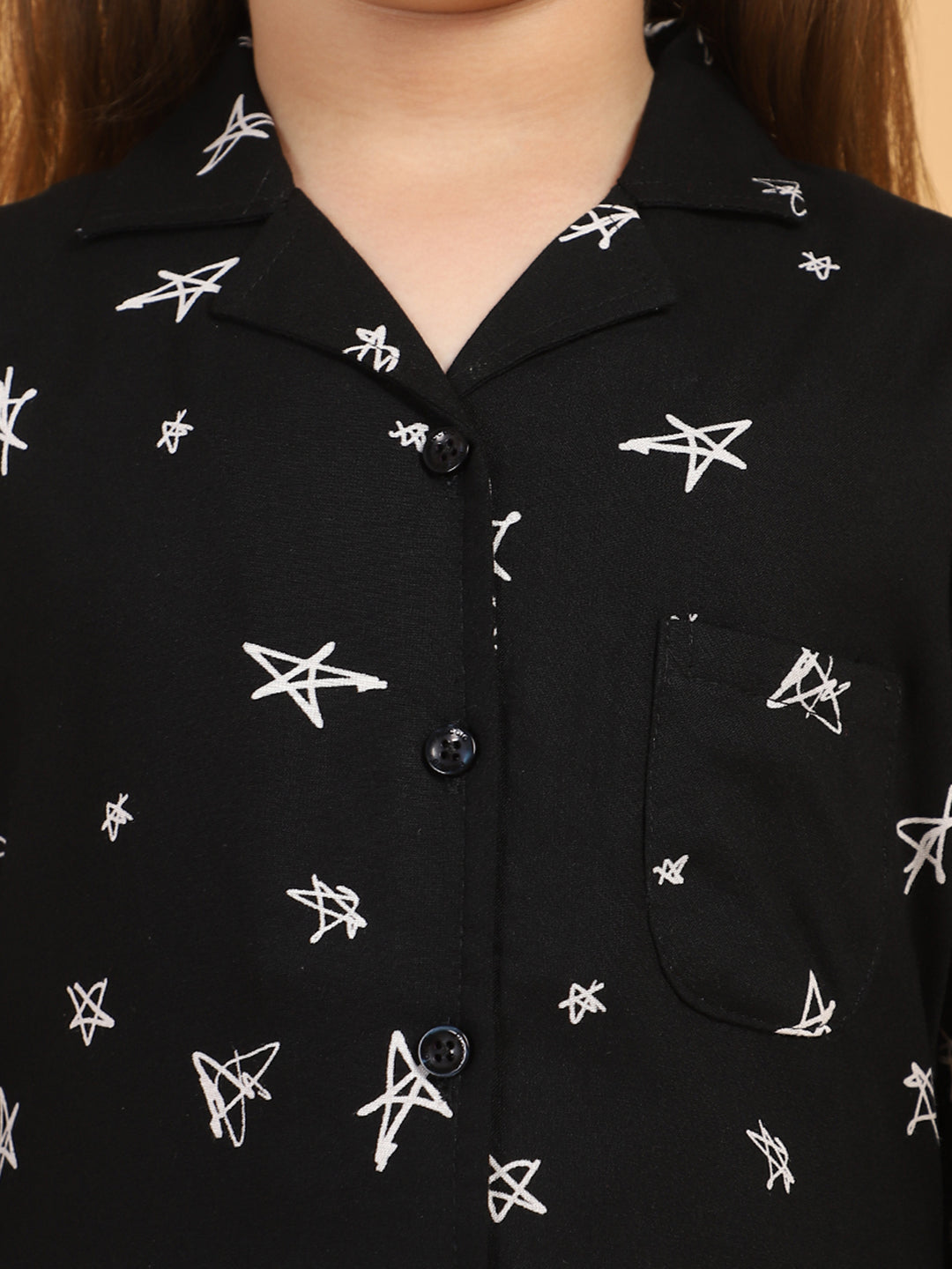 Black shirt with white star patterns
