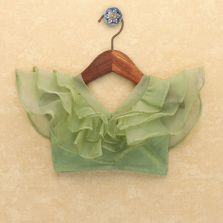 Green ruffled blouse 