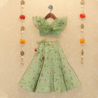 Girls Green Ruffled Blouse And Floral Lehenga Set